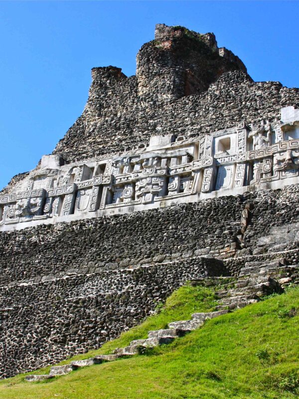 Ground view of Xunantunich Maya Ruins with ancient temple structures.
