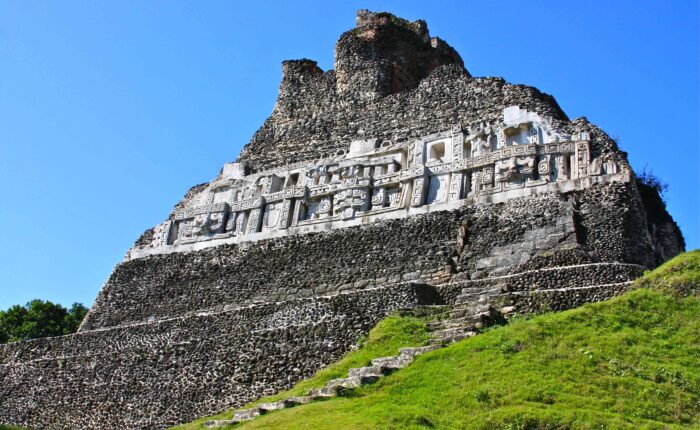 Ground view of Xunantunich Maya Site with ancient temple structures.