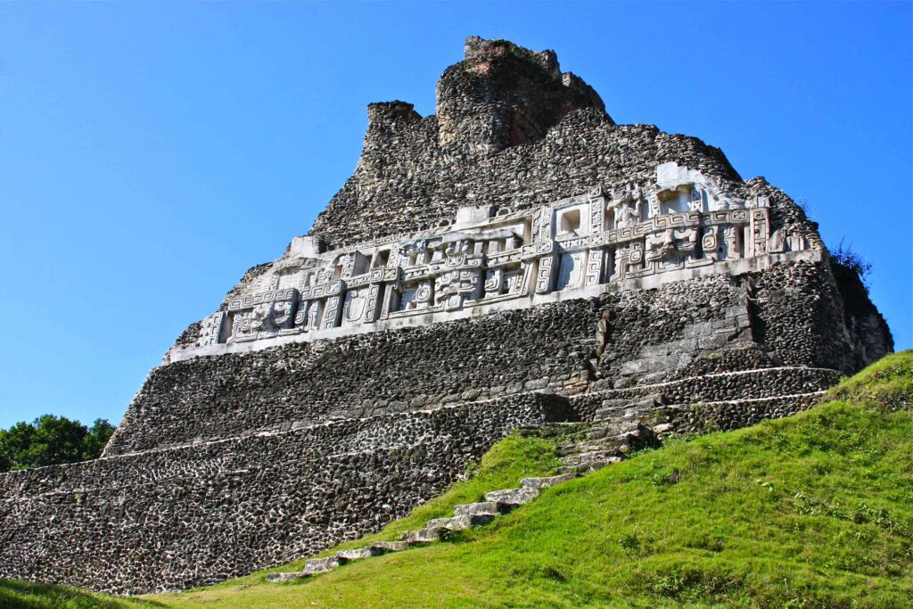 Ground view of Xunantunich Maya Site with ancient temple structures.