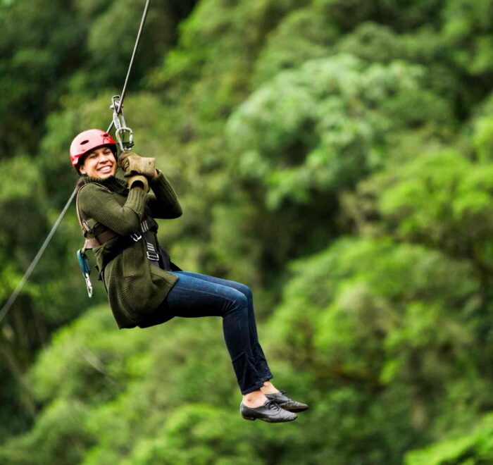 Bocawina Zipline Adventure: Close-up of a woman ziplining, capturing the excitement of the experience.